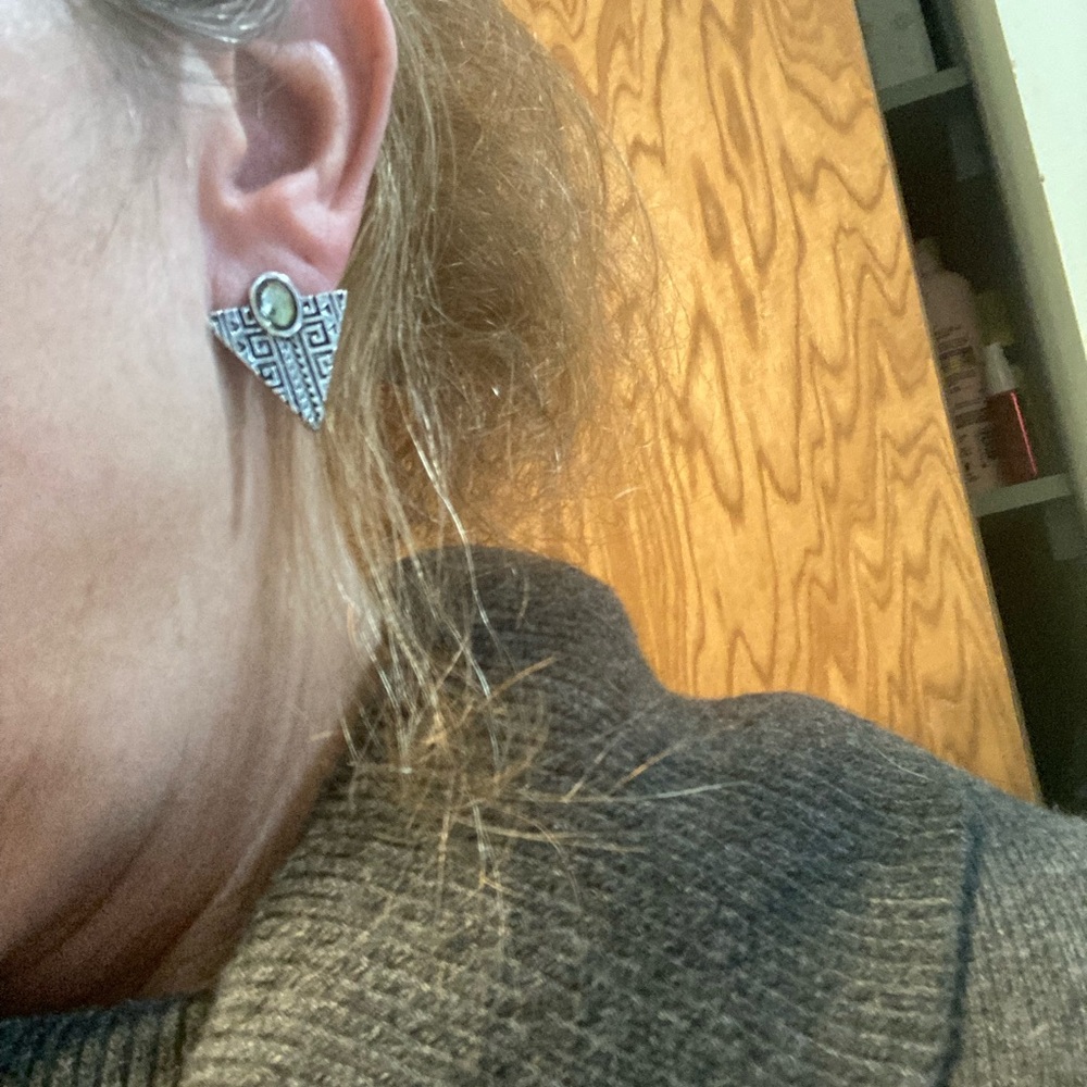 Silvertoned geometric earrings with yellow green colored stone